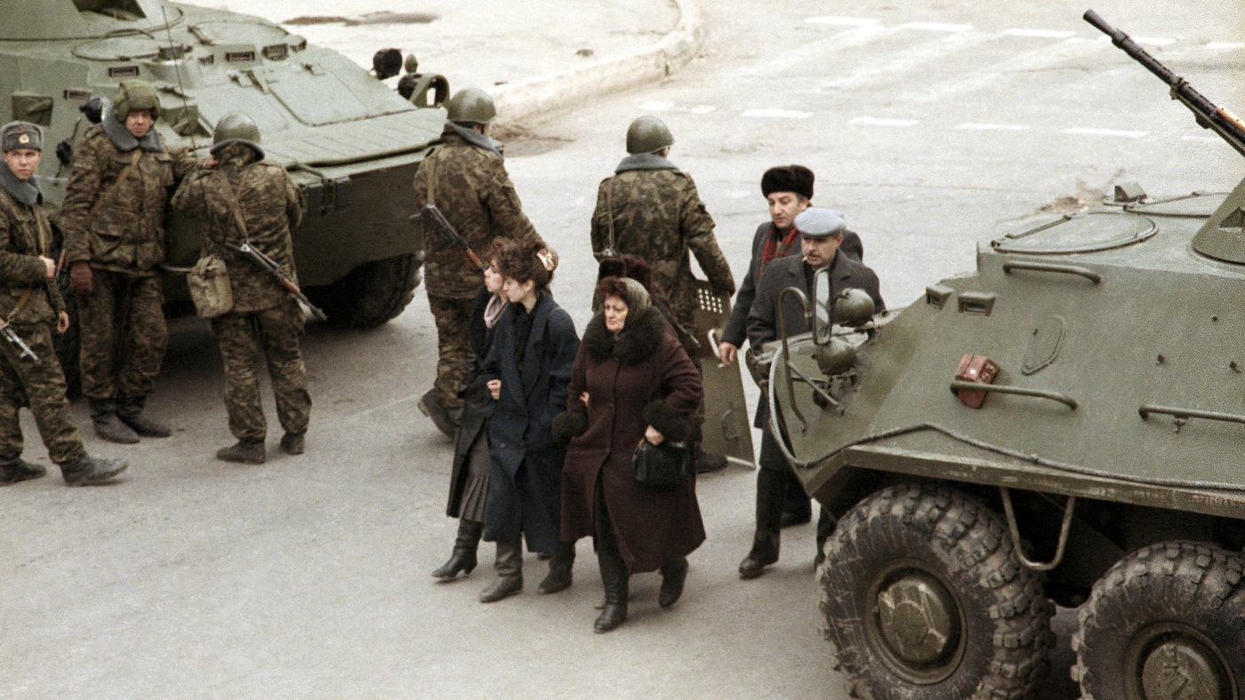 A group of Azerbaijanis walks between a pair of Soviet tanks in Baku, capital of Azerbaijan on Saturday, Jan. 28, 1990. The Soviet army invaded the republic earlier this month to quell ethnic violence and to put down a growing nationalist movement. (AP Ph