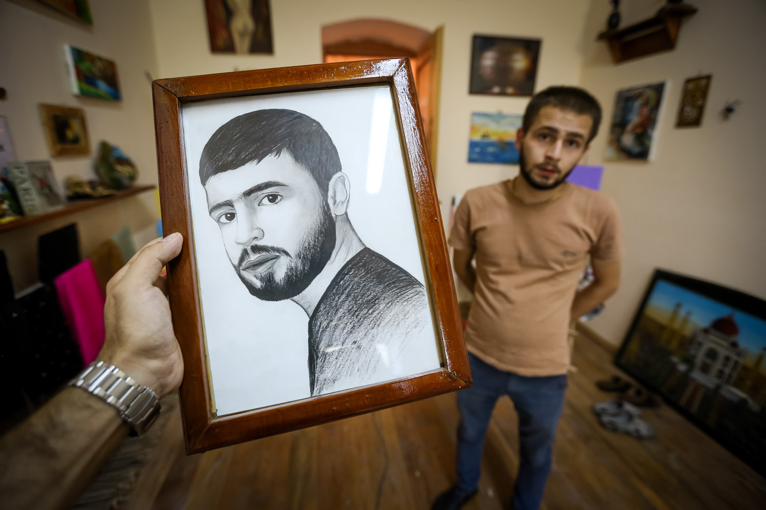 A self portrait of Elkhan Karimov. In his free time, he commissions portraits and draws