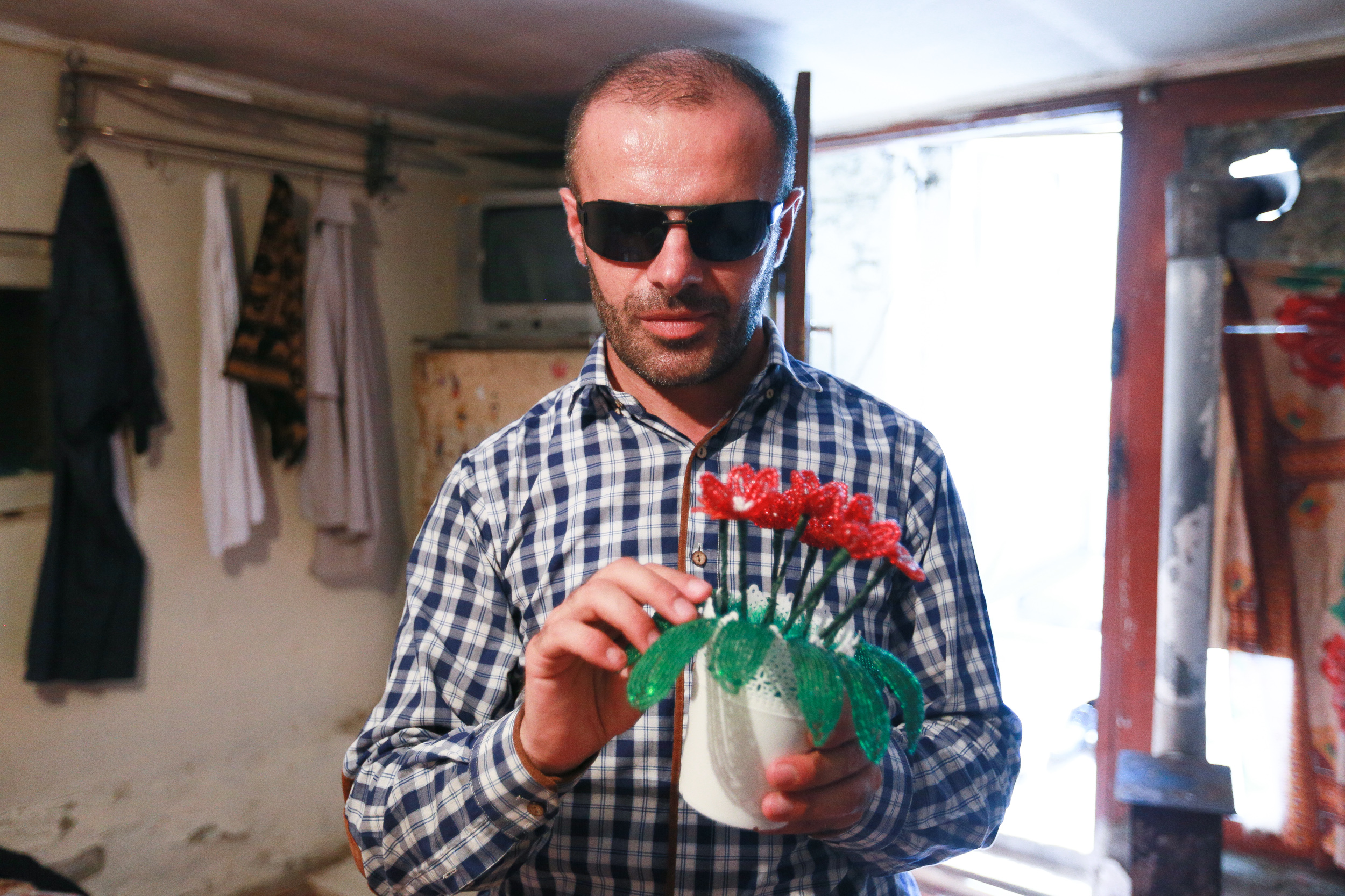 Elchin displays a new addition to his goods