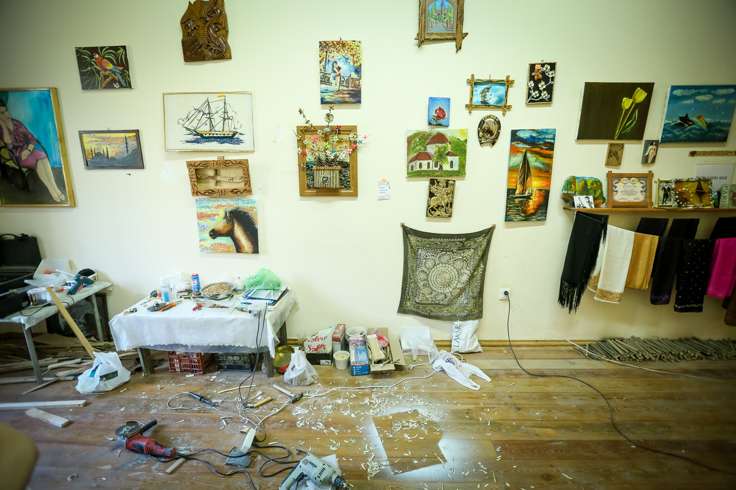 Elkhan hangs and displays his works in his own work room