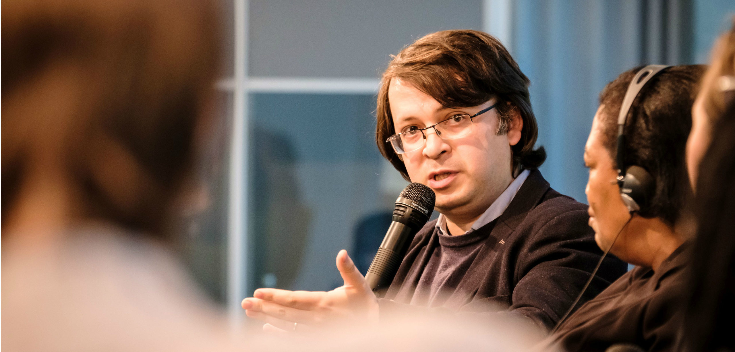 Emin Milli, director of Meydan TV, speaks at an event hosted by the Heinrich Böll Stiftung in Berlin on April 27.  Photo credit: ANDI WEILAND (Flickr)