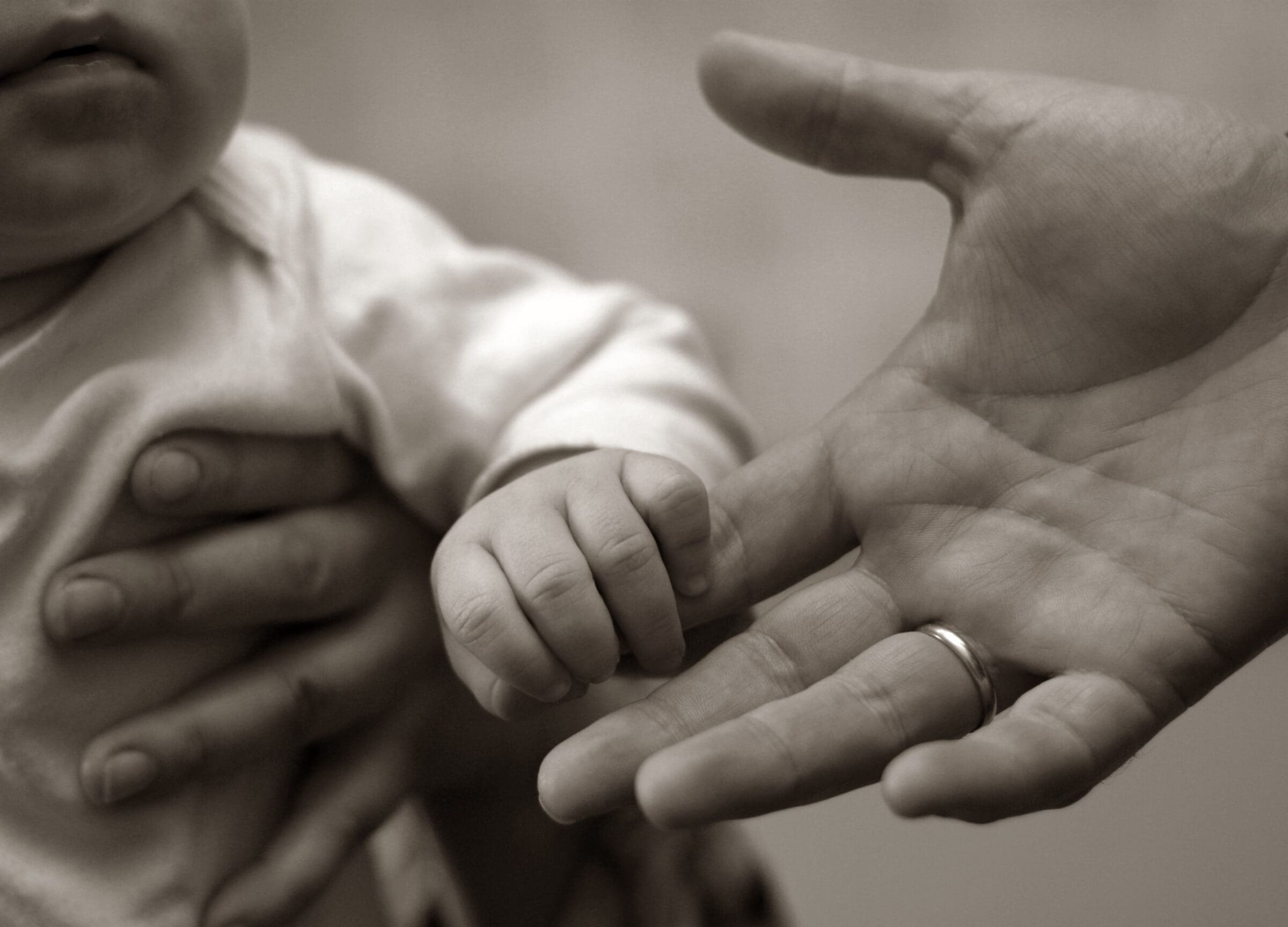 family babe baby babies childhood child eyes white face pink young look mother ring adult sitting son father kid parents soft hands infant pure emotion children little emotions daughter feeding hat sad parent fingers