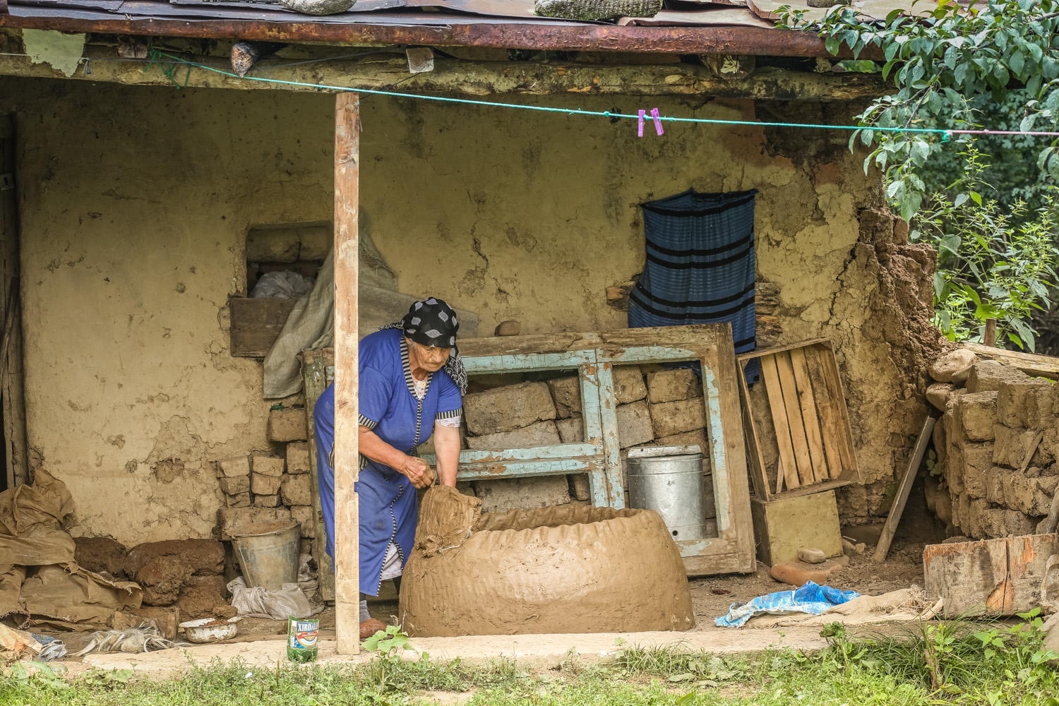 Granny Madina is working on a new order for a tandoor oven