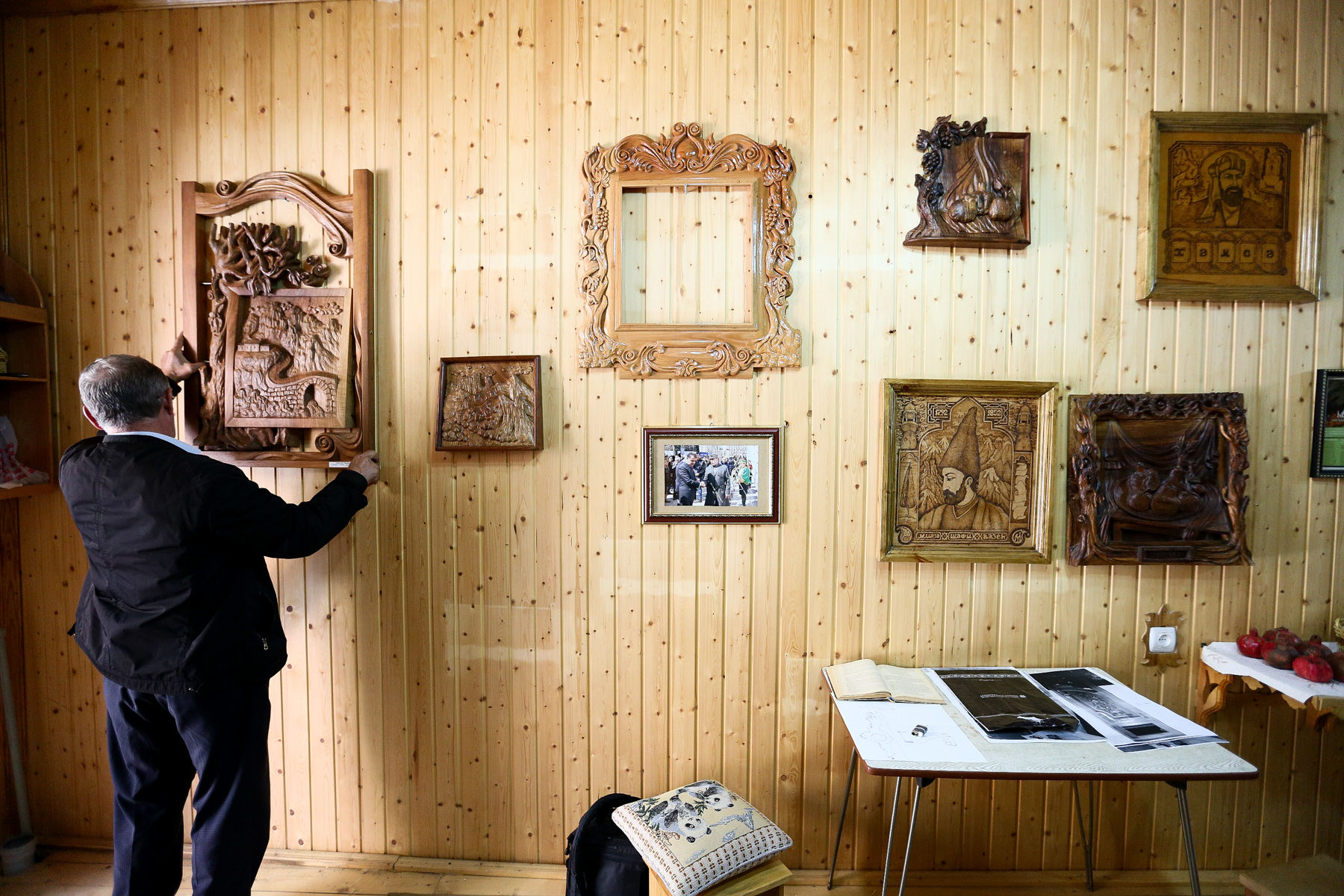 Some of his works he keeps within his own house and hangs them on the walls.