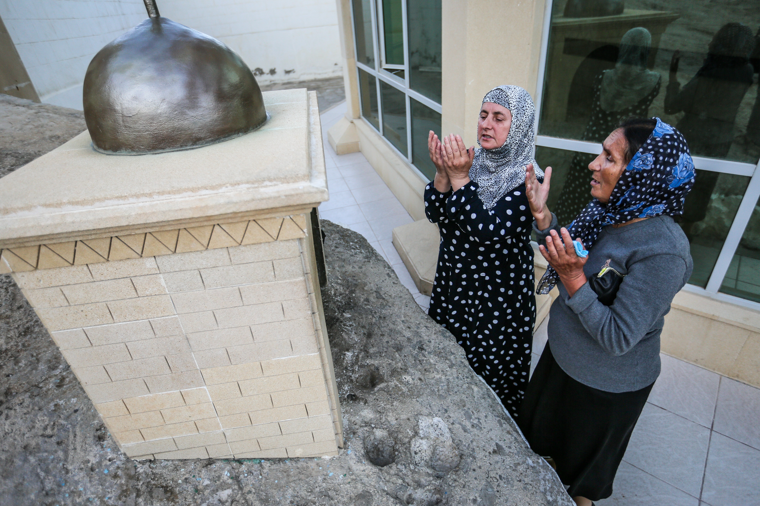 Two pilgrims praying