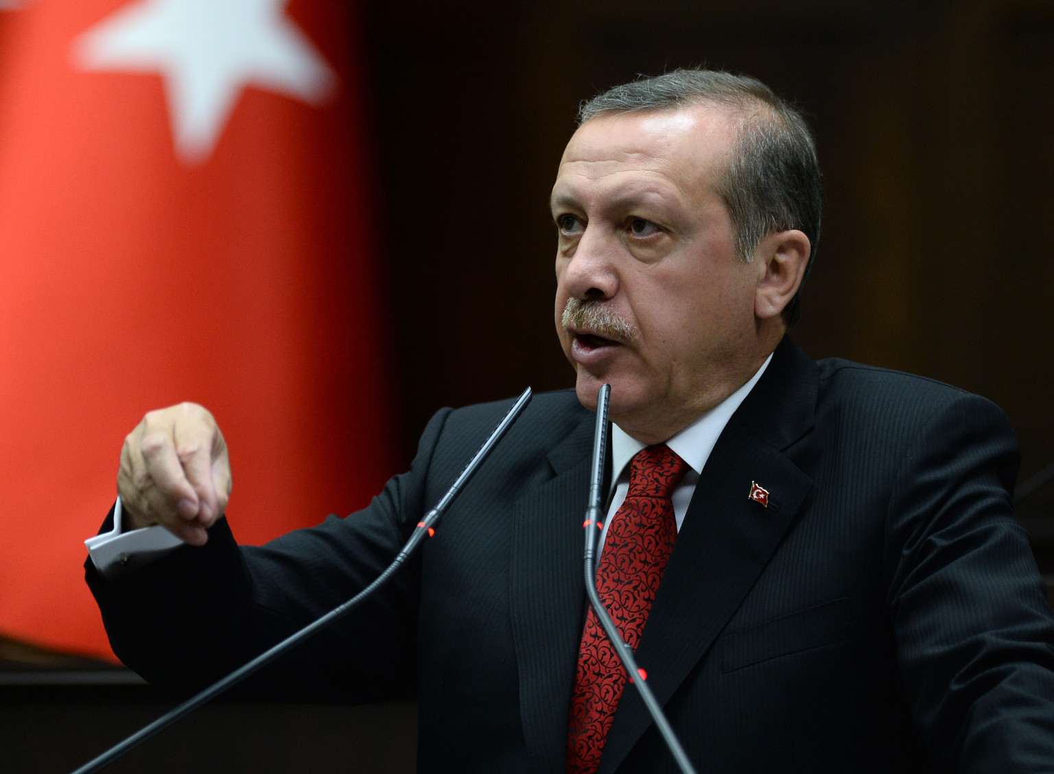 Turkey's Prime Minister Recep Tayyip Erdogan addresses his lawmakers at parliament, in Ankara, Turkey, Tuesday, June 18, 2013. Turkish Prime Minister Recep Tayyip Erdogan says he will increase police powers following a wave of anti-government protests. T