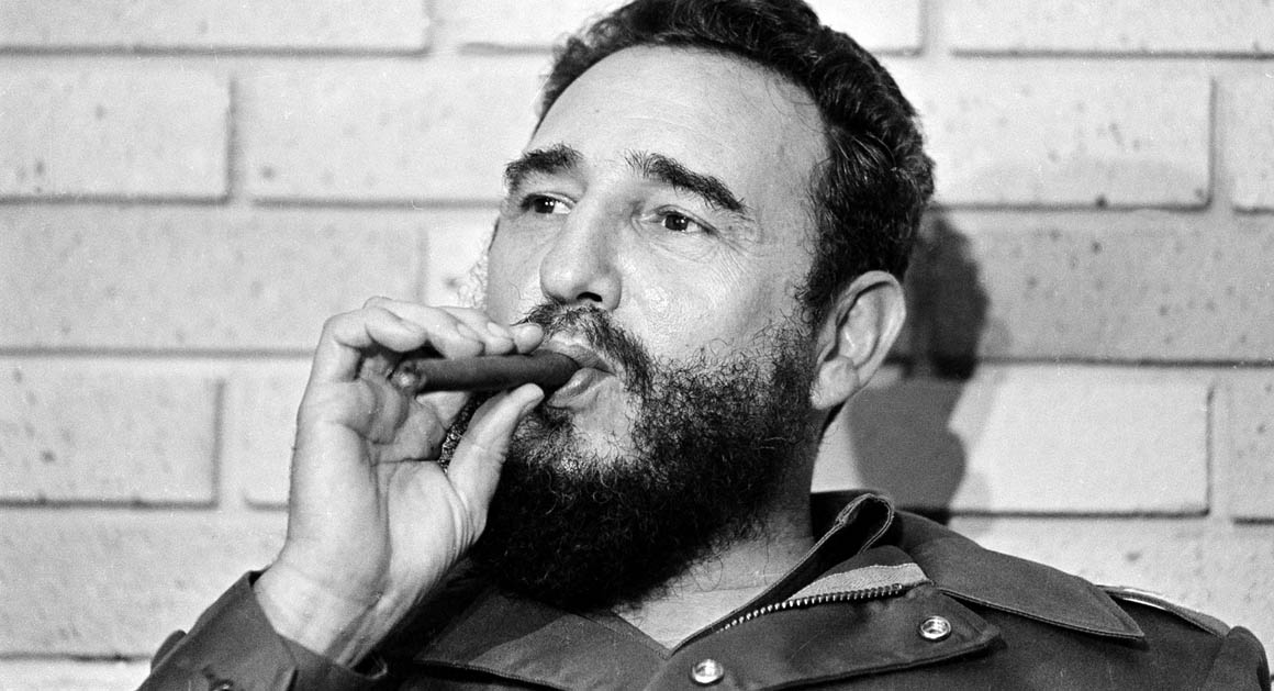 Fidel Castro, smokes a cigar during his meeting with two U.S. senators, the first to visit Castro's Cuba, in Havana, Cuba, Sept. 29, 1974. (AP Photo)