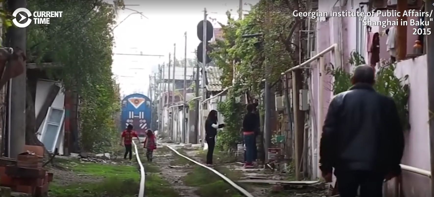 The 'Shanghai' slum in Baku, divided by rail tracks (screengrab from video)