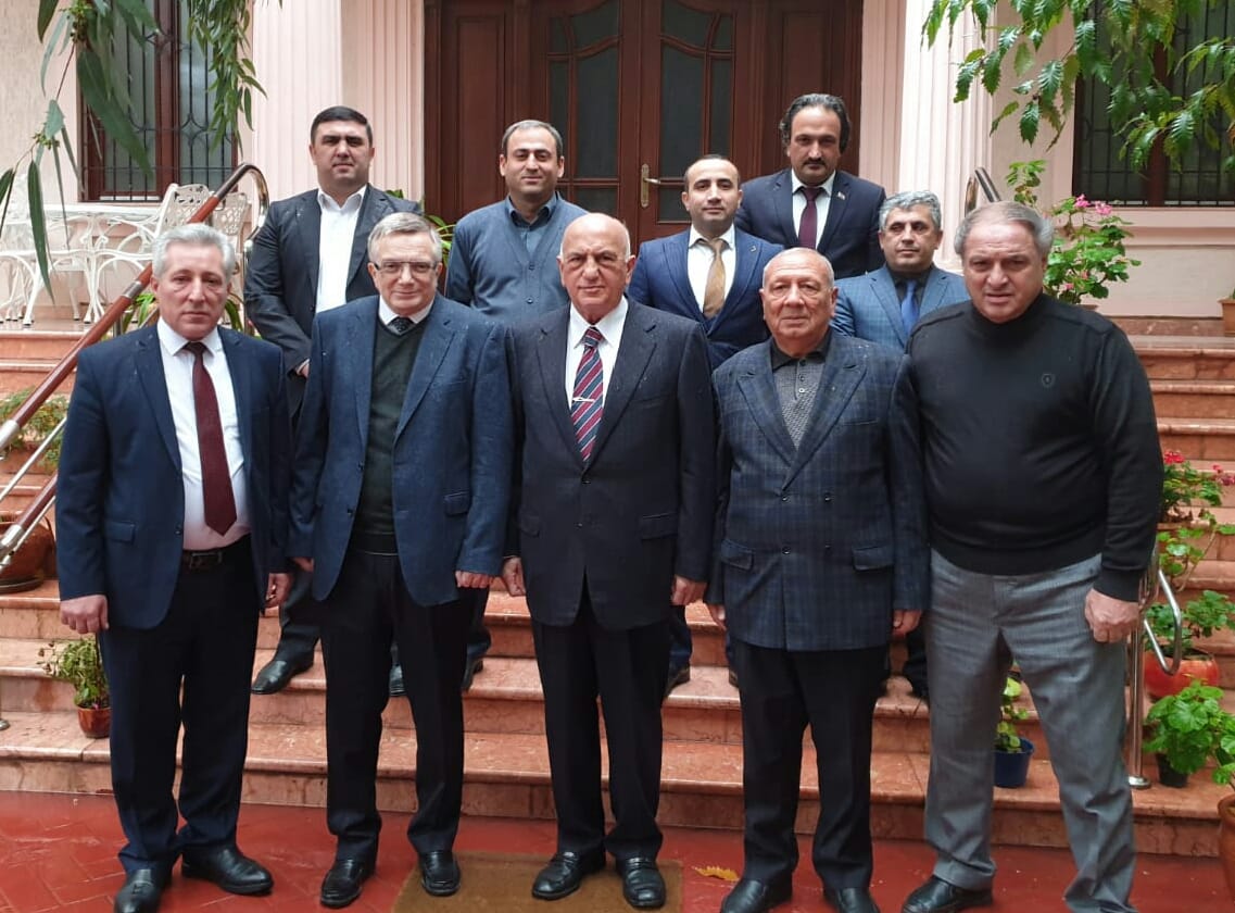Former Health Minister Ali Insanov (3rd from R) along with his associates after the Justice Party was announced in Baku on November 24.