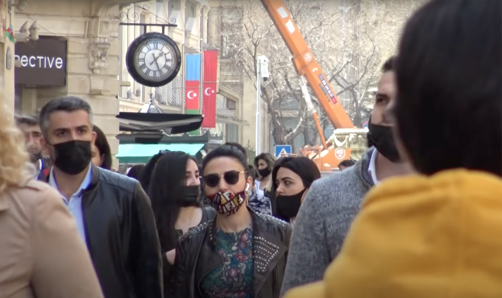 People walk the streets of Baku. March, 2021.