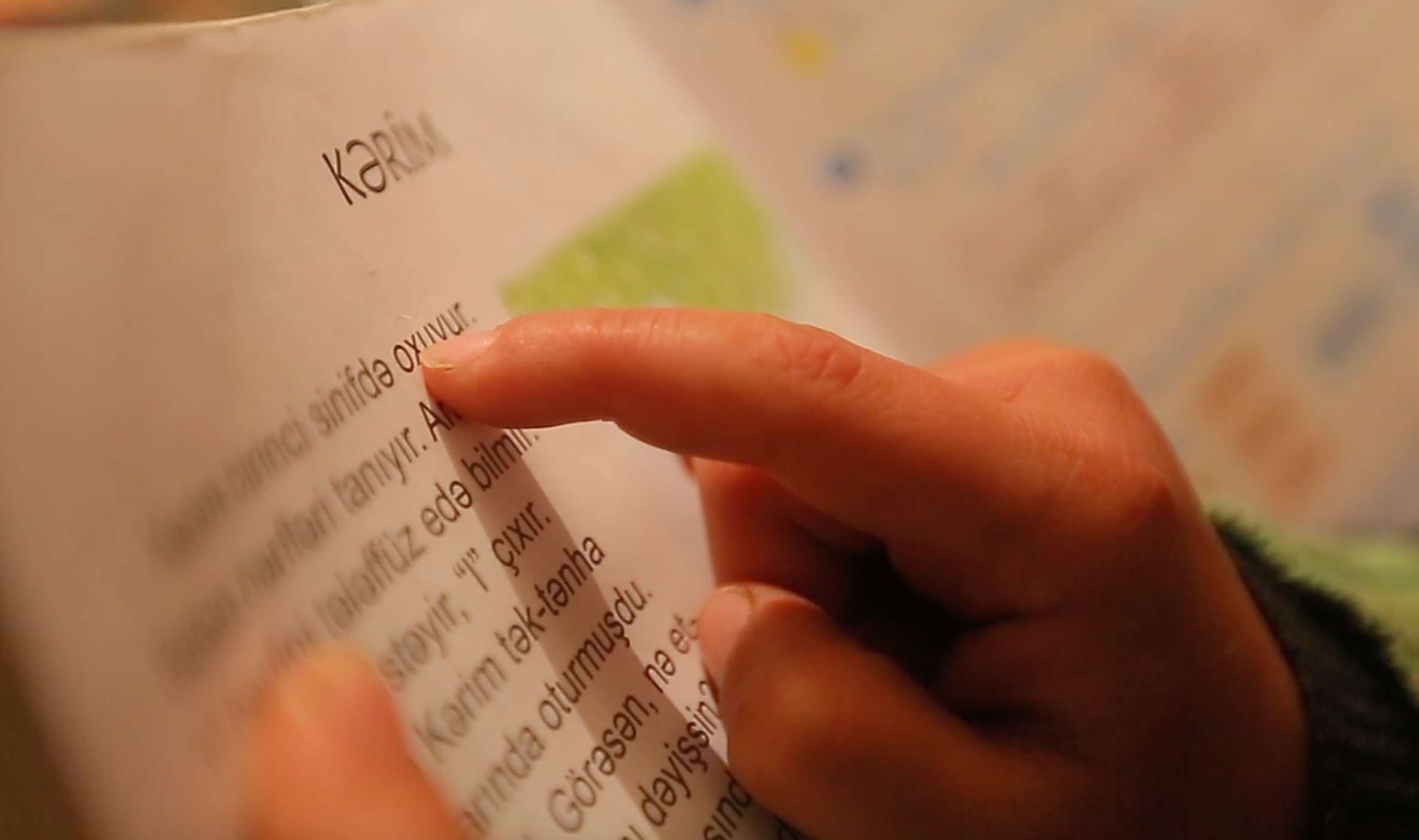 A child in Shabran region practices reading