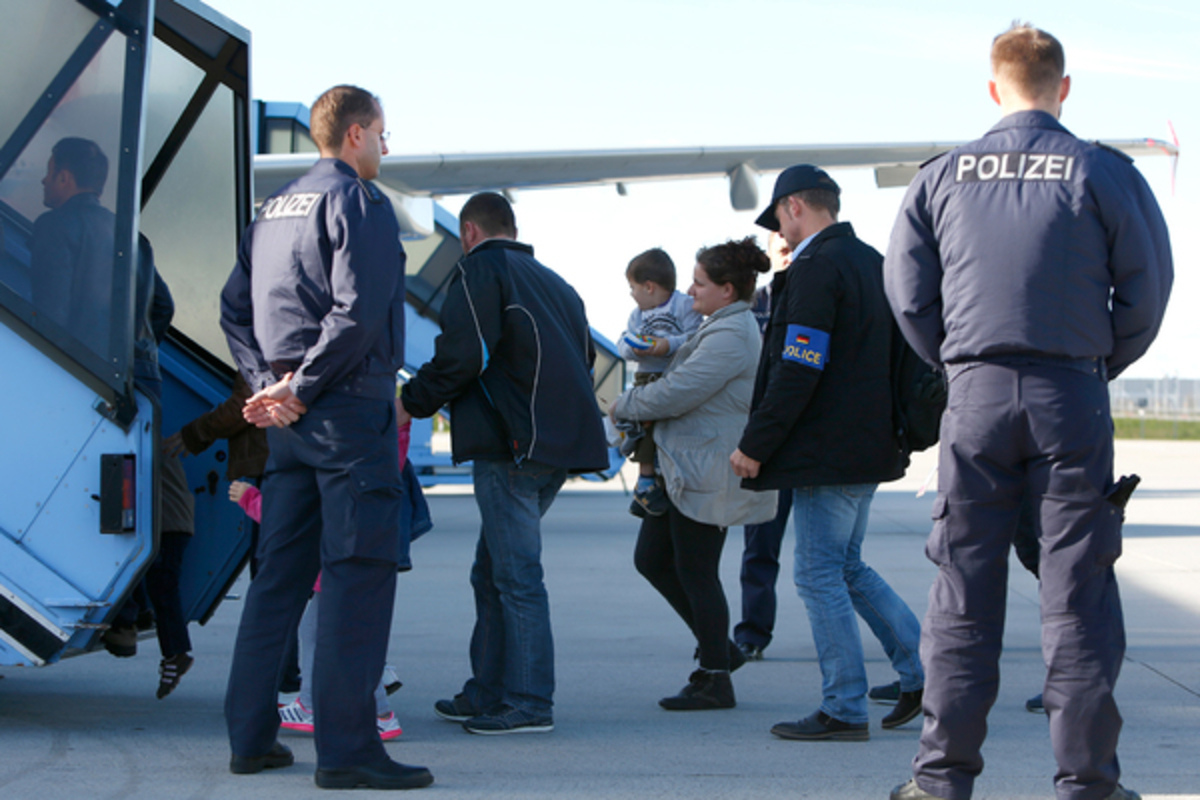 German security forces accompany Azerbaijanis to the charter flight to the capital city of Baku.